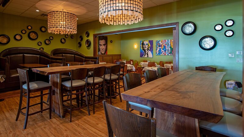 Dining room with high-top chair seating and booths.